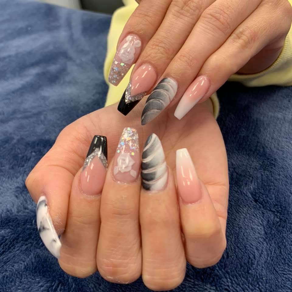 Pink, black and white nails with marble, glitter and French-tip details