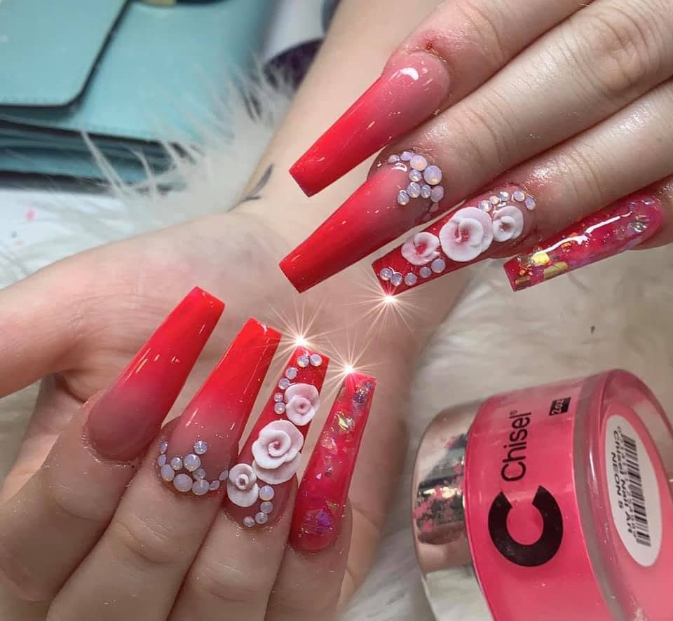 Red ombre nails with sculpted white roses and crystal accents