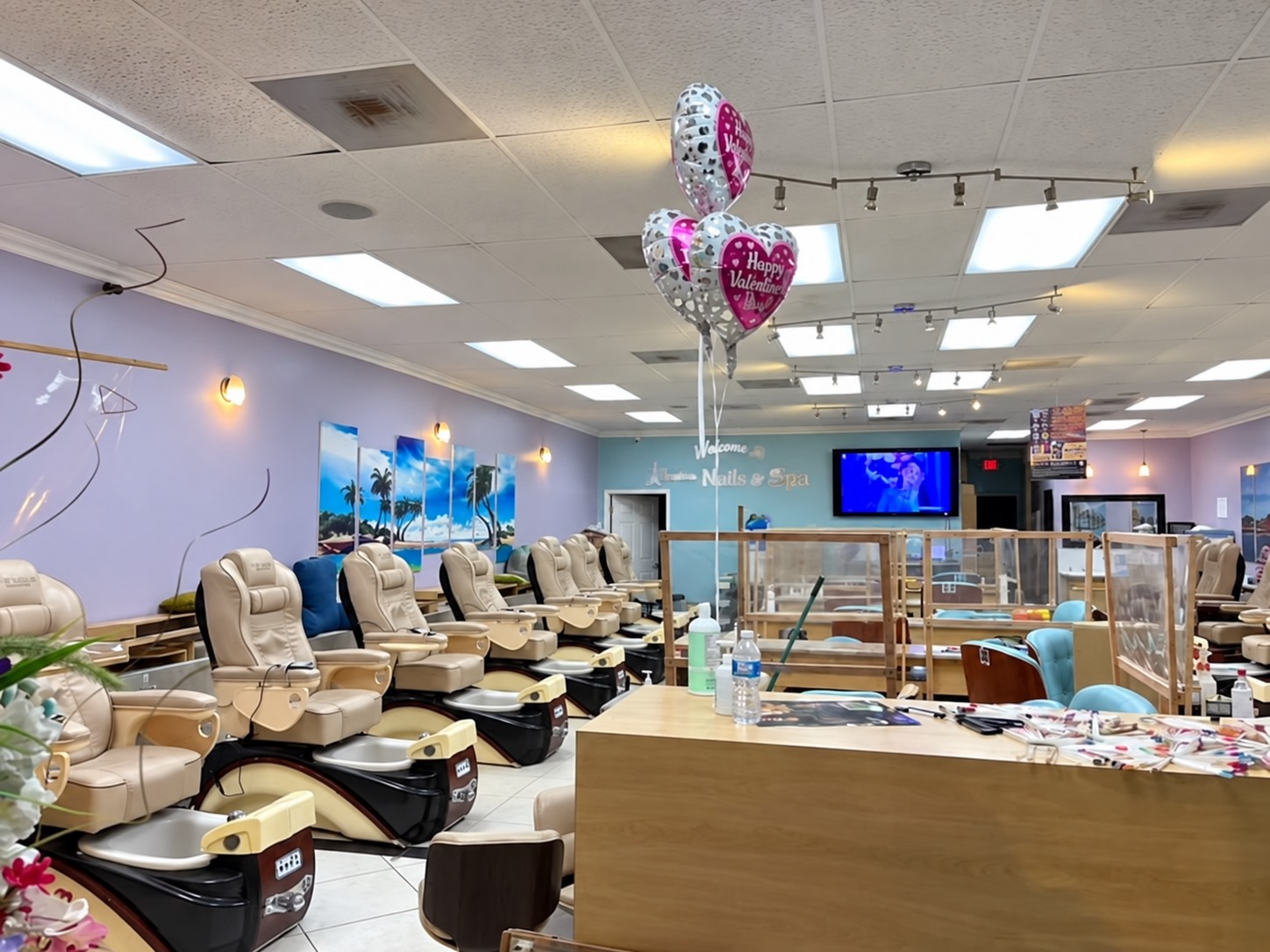 Inside Jessica Nails & Spa, with pedicure chairs and manicure stations